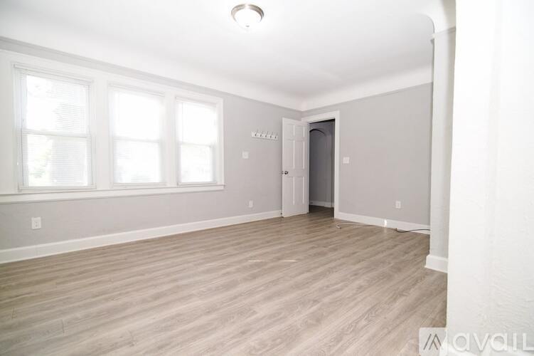 A kitchen with a table and chairs in the middle of the room.