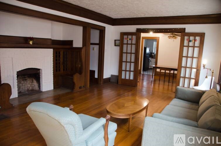 A living room with a fireplace and a couch.