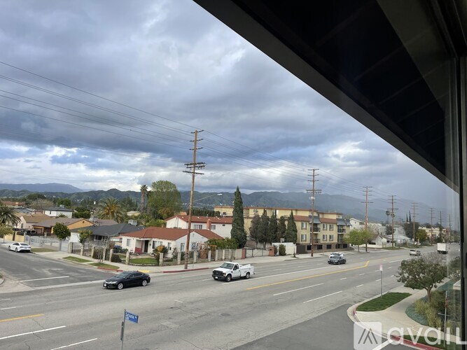 A street view with cars and buildings.