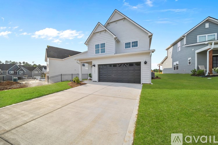 A house with a garage is available for sale.