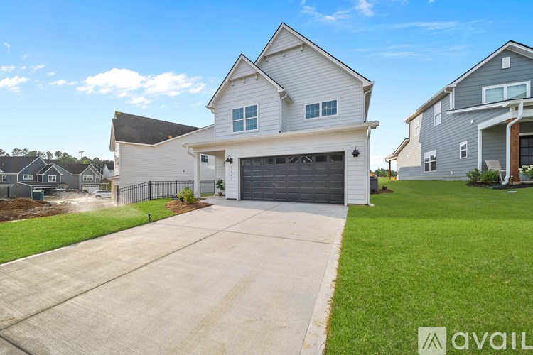 A house with a garage is available for sale.