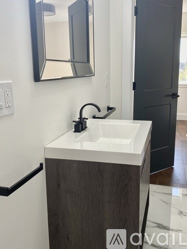 A bathroom sink with a mirror above it.