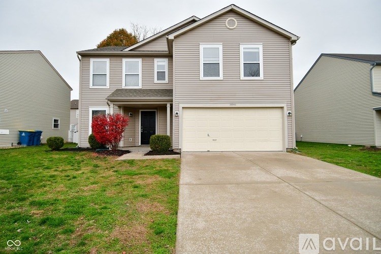 A two-story house with a garage is available for rent.