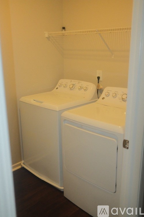 A laundry room with two washing machines.