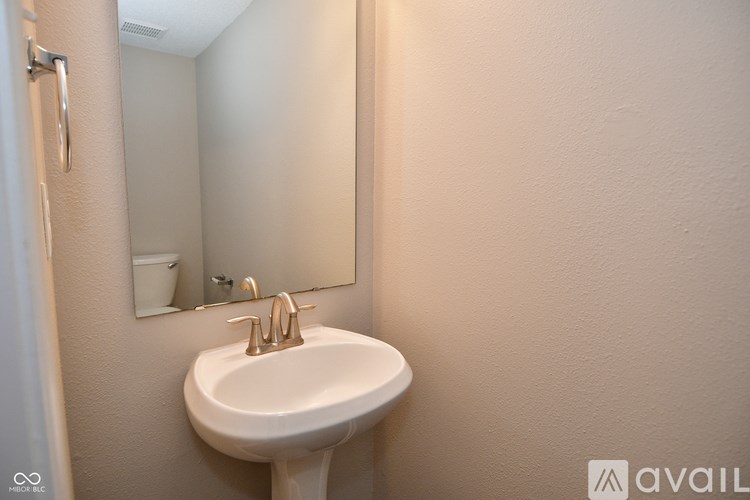 A bathroom sink with a mirror above it.