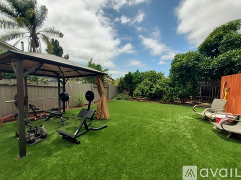A backyard with a gym setup and a drone.