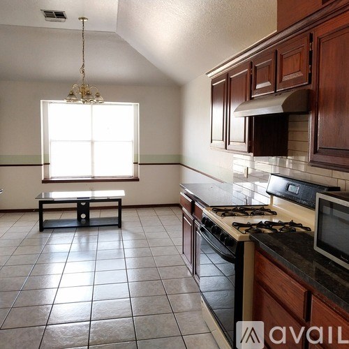 A kitchen with a bench and a window.
