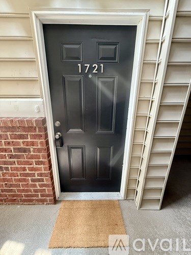 A black door with the number 1721 on it.
