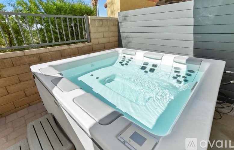 A hot tub with a control panel and a digital display.