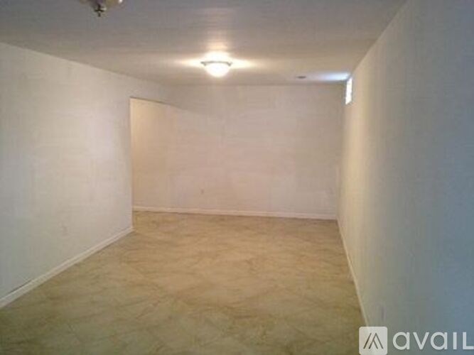 Empty room with beige carpet and white walls.