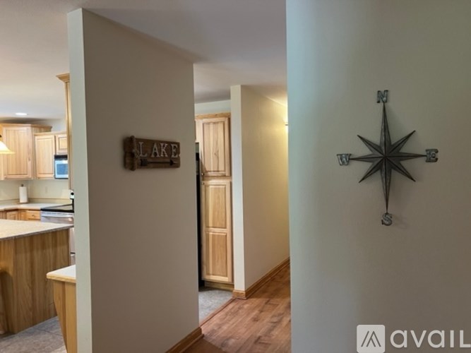 A room with a compass on the wall and a sign that says Lake.