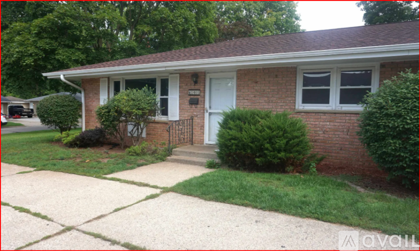 A house with a white door and a small porch.
