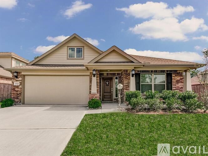 A house with a brown roof and a garage door.
