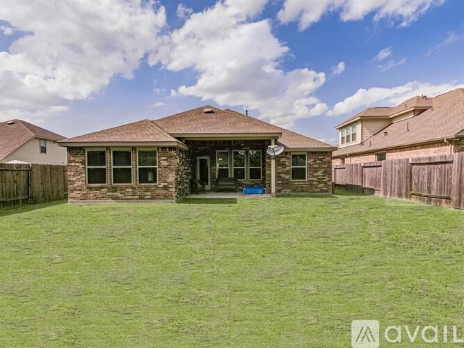 A house with a lawn in front of it is for sale.