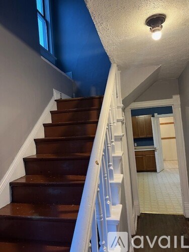 A staircase with a light on the ceiling.
