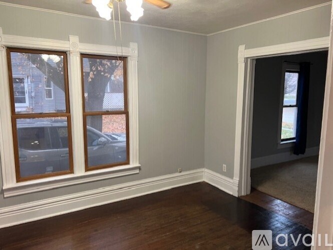 A room with a window and a door.