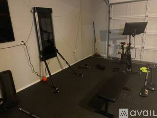 A black stage with a speaker, microphone, and other equipment.