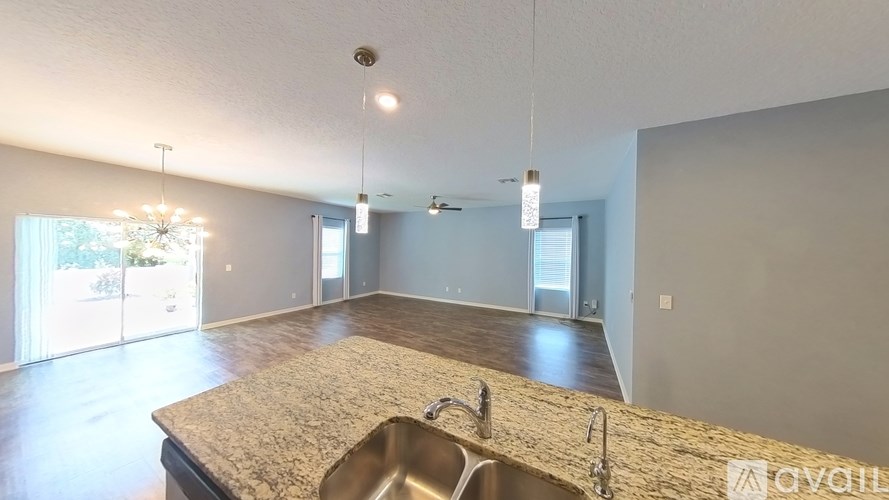A kitchen with granite countertops and a sink.