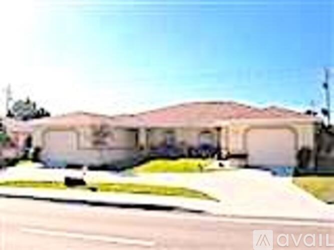 A house with a garage is available for sale.