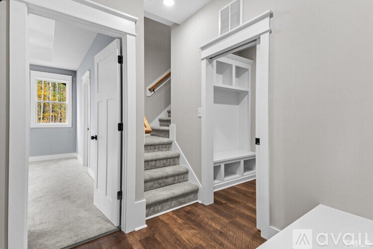 A room with a staircase leading to the upper floor.