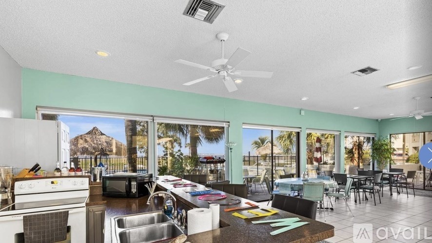 A spacious kitchen and dining area with a view of the outdoors.