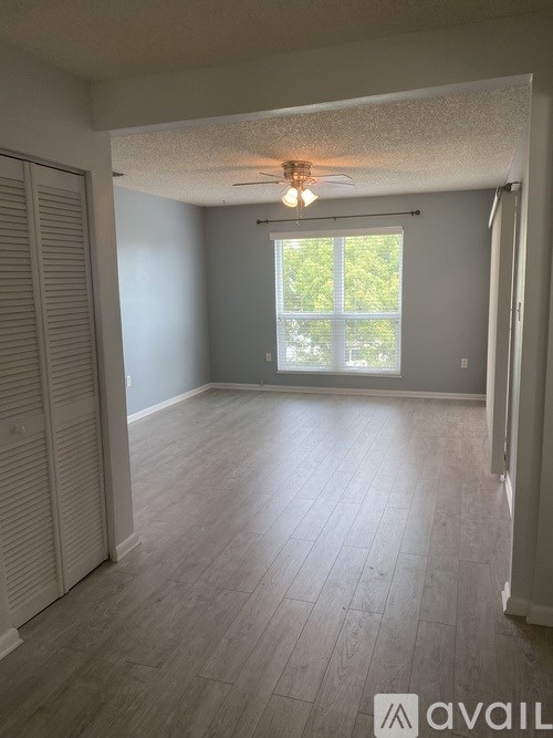 A room with a sliding door and a window.