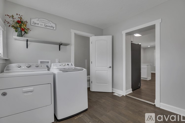 A laundry room with a washer and dryer.