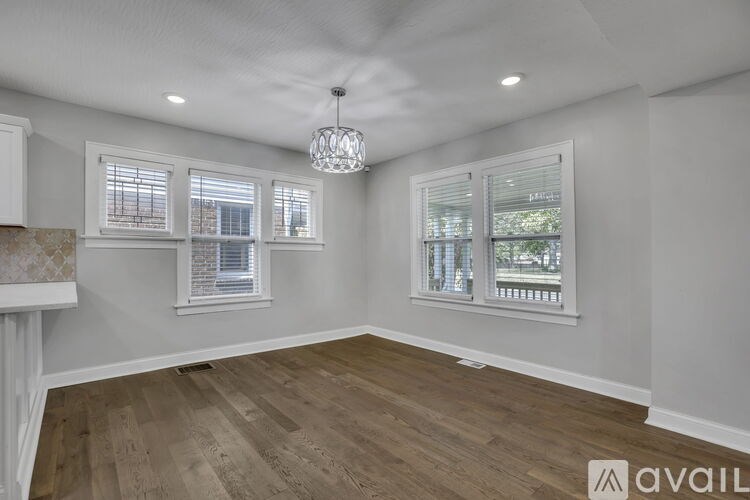 A bathroom with a sink, mirror, and toilet.