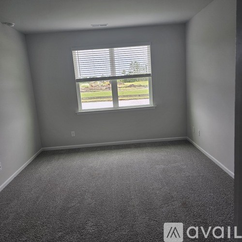 A room with a window and Avail sign.