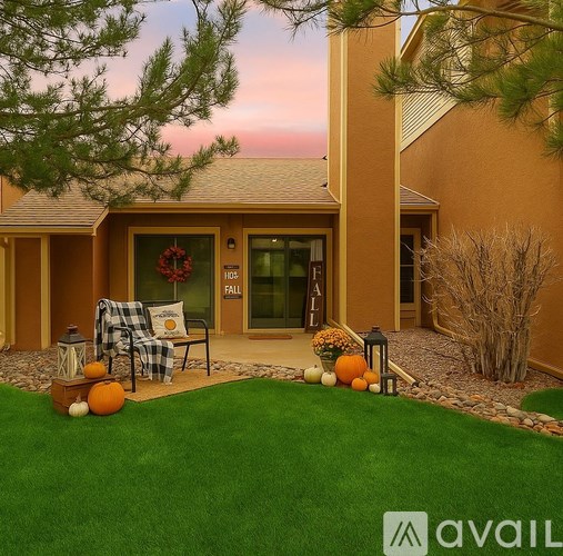 A bathroom with a sink, mirror, and wooden cabinets.
