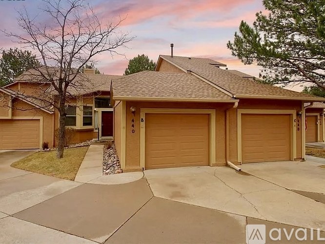 A house with a brown garage door is for sale.