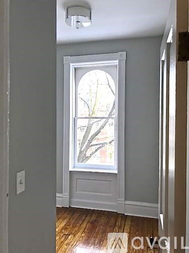 A white door with a window above it.
