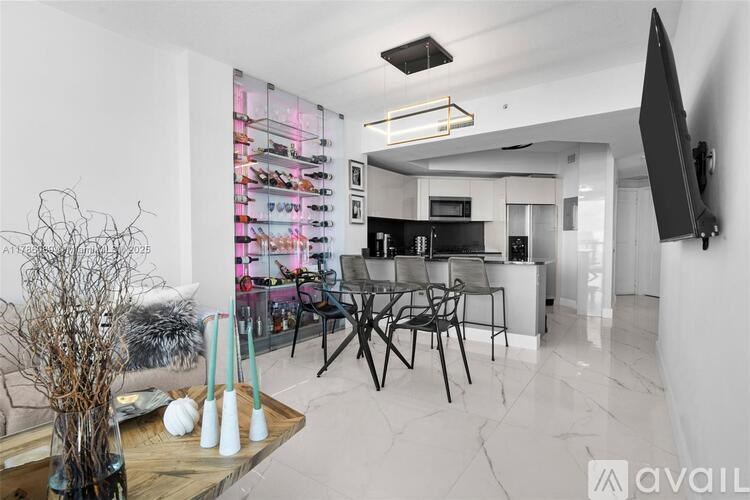 A modern living room with a wooden coffee table and a flat screen TV mounted on the wall.