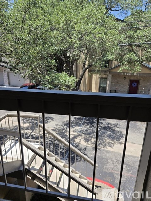 A view from a balcony looking down at a staircase.