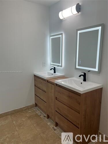 A bathroom with a sink and mirror.