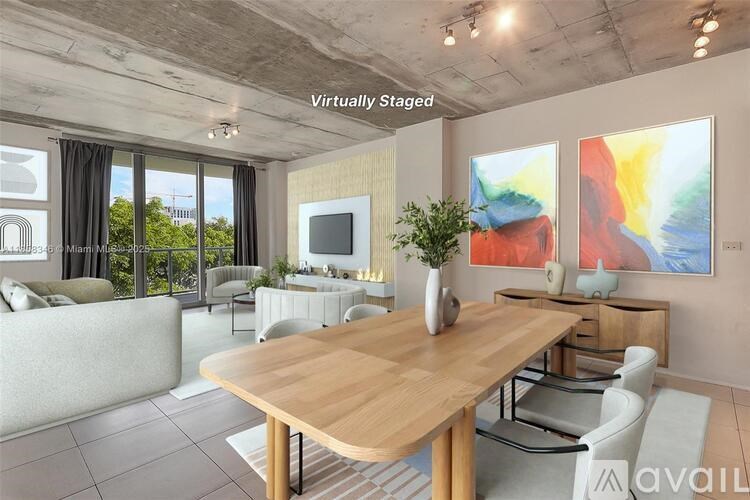 A modern living room with a dining table and chairs.