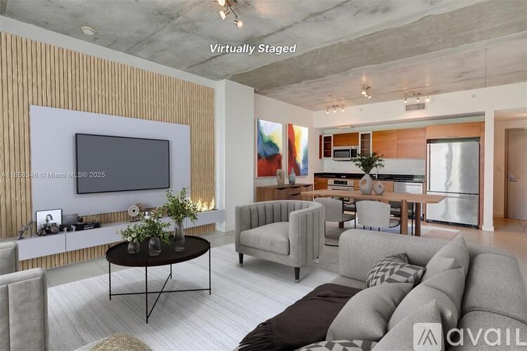 A living room with a television, sofas, and a coffee table.