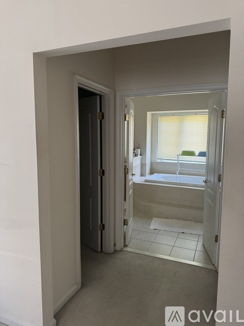 A room with a door and a window.