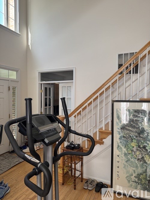 A treadmill is in the middle of a hallway.