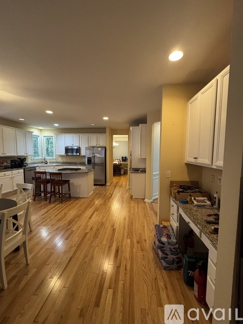 A kitchen with granite countertops and stainless steel appliances.