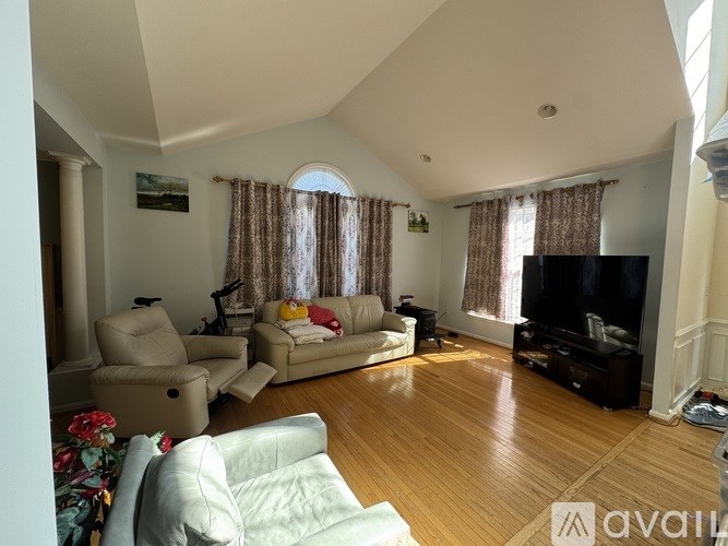 A kitchen with a dining table and chairs in the middle of the room.