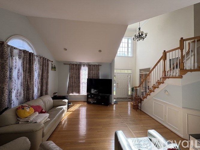 A kitchen with a granite countertop and stainless steel appliances.