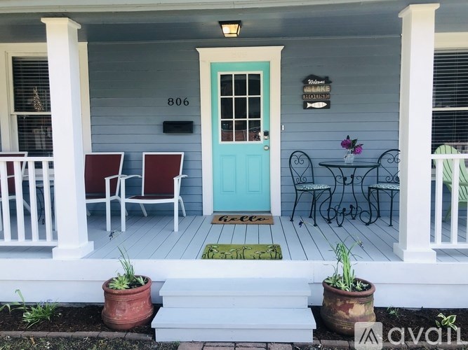 A blue door with a sign above it that says "Stevens".