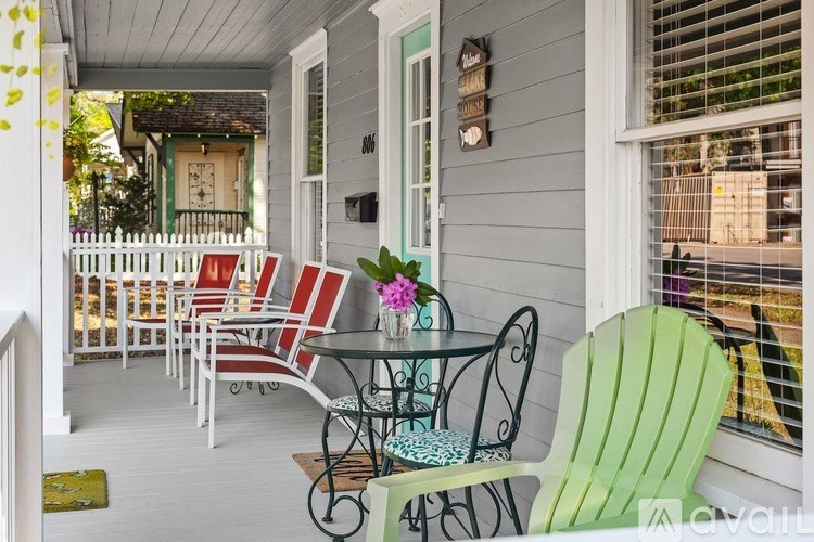 A patio with a table and chairs.