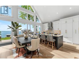 A modern kitchen with a dining table and chairs.