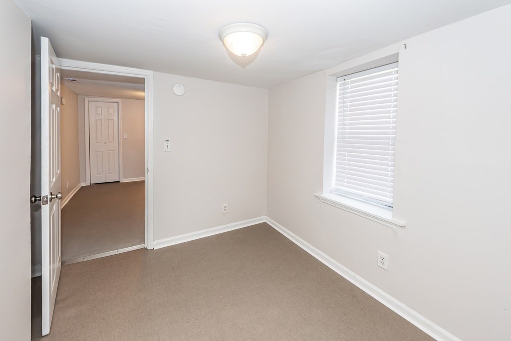 A room with a door and a window.