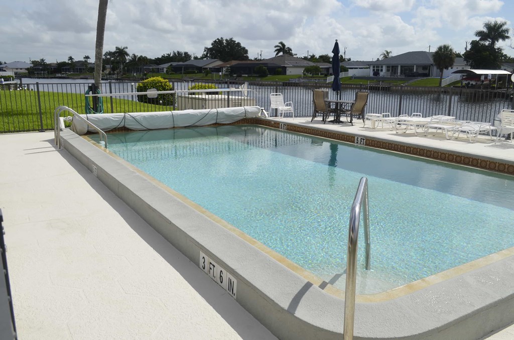 A rectangular pool with a metal pole in the middle.