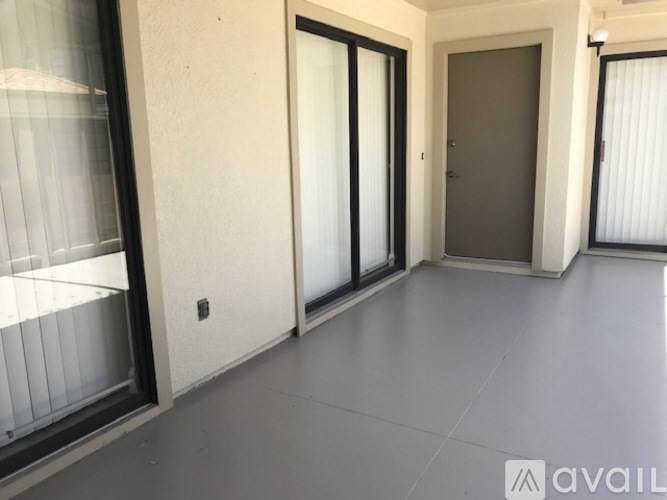 A room with a glass door and a closed door.