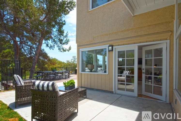 A patio with a table and chairs is available for rent.