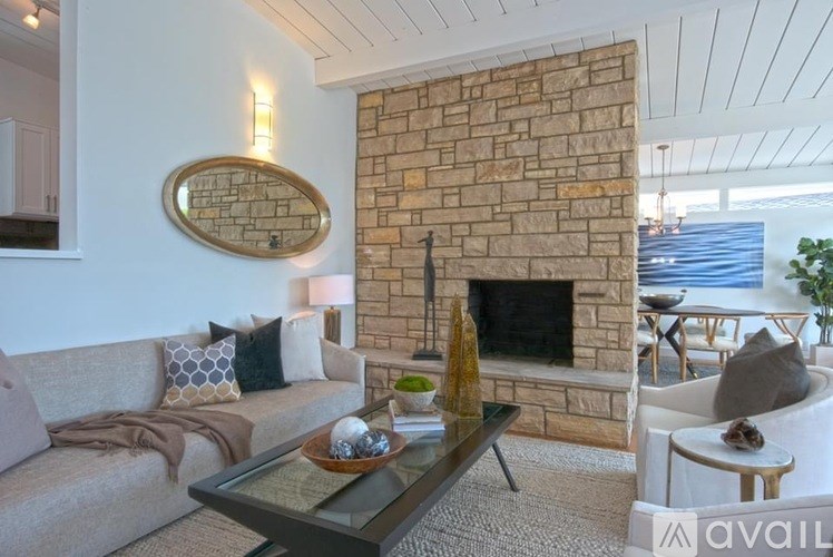 A living room with a fireplace and a couch.